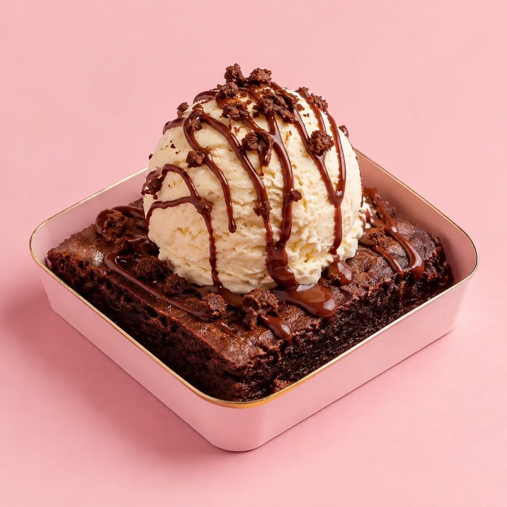 Warm fudgy brownie topped with a scoop of vanilla ice cream